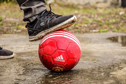 muddy soccer ball